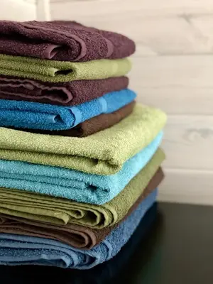 a pile of towels stacked on top of each other at Guest House Mr Fox in Druskininkai