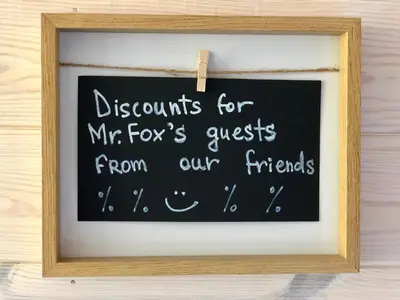 a chalkboard with documents for mr foxs guests from our friends at Guest House Mr Fox in Druskininkai