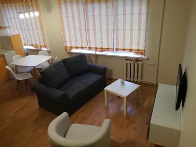 a living room with a couch and a table at Apartment for rent Druskininkai in Druskininkai
