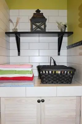 a bathroom with a counter with a basket on it at Luxury Apartment in Druskininkai