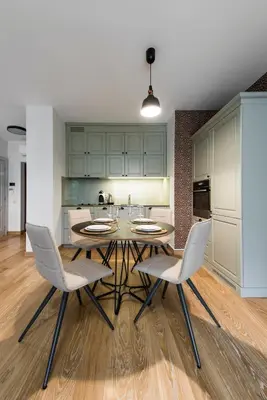 a kitchen with a table and chairs in a room at SoulHouse apartments in Druskininkai
