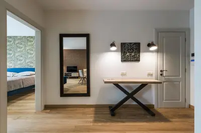 a dressing room with a table and a mirror at SoulHouse apartments in Druskininkai