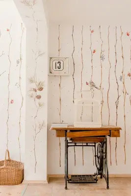 a table in a room with a clock on the wall at Villa Kurorto Namas in Druskininkai