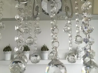 a group of glass vases on a table with plants at Angel's Dream Apartment in Anykščiai