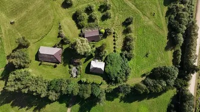 an aerial view of a house in a field at Kačiūniškis in Kaciūniškiai