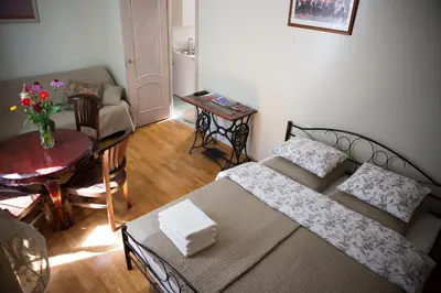 a living room with a couch and a table at Centro apartment near Gedimas Avenue in Vilnius