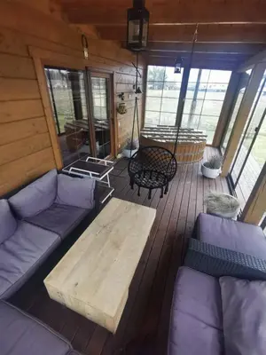 a living room with a couch and a coffee table at Arturas Guest House in Vilnius
