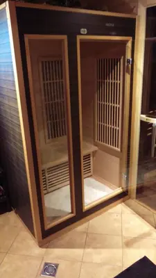 a pair of glass doors in a room at Arturas Guest House in Vilnius