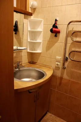 a bathroom with a sink and a shower at Vidų Guest House in Utena