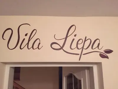 a sign that reads villa iecca on a wall at Vila Liepa in Birštonas