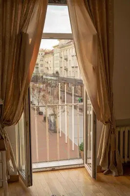 an open window with a view of a city at Broadway apartament in Šiauliai