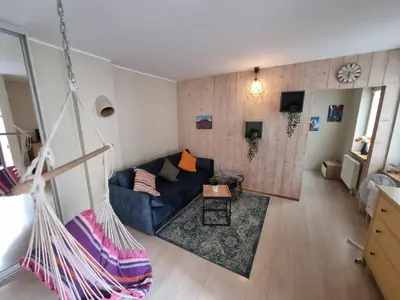 an overhead view of a living room with a blue couch at Igo Apartment Townhall in Vilnius