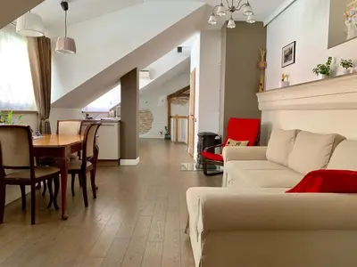 a living room with a couch and a table at Very Vilnius Pilies street in Vilnius