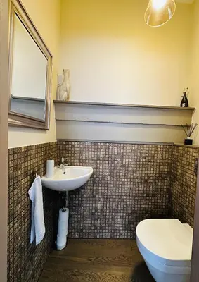 a bathroom with a sink and a toilet at Very Vilnius Pilies street in Vilnius