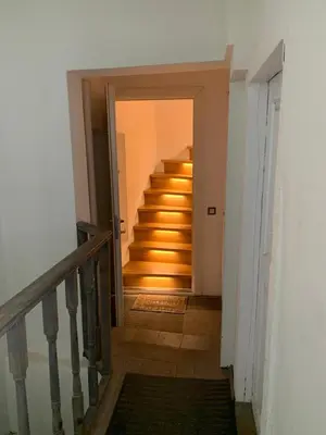 a hallway with stairs leading up to a house at Very Vilnius Pilies street in Vilnius