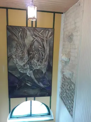 a painting on the wall of a bathroom with a window at Vilnius Luxury Apartment 2 in Vilnius