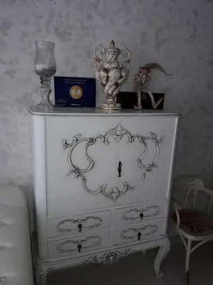 a white dresser with vases on top of it at Vilnius Luxury Apartment 3 in Vilnius