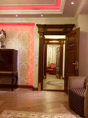a living room with a door leading to a living room at Luxury Pilies Avenue Apartment in Vilnius