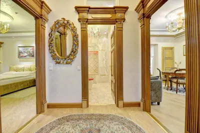 a living room with a large mirror on the wall at Luxury Pilies Avenue Apartment in Vilnius