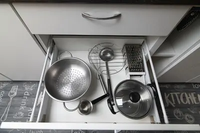 a kitchen with various utensils in a drawer at Vilnius Old Town Happiness in Vilnius