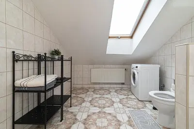 a bathroom with a toilet and a sink at Vilnius Old Town Happiness in Vilnius