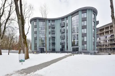 a building with snow in front of it at 555 SoleSun in Druskininkai
