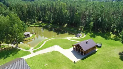 an aerial view of a house and a lake at Auksinis Ąžuolas in Avižieniai
