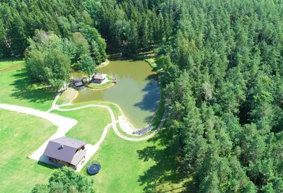 an aerial view of a house and a lake at Auksinis Ąžuolas in Avižieniai