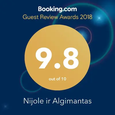 a yellow circle with the text quest review awards in alphannas at Nijole ir Algimantas in Anykščiai