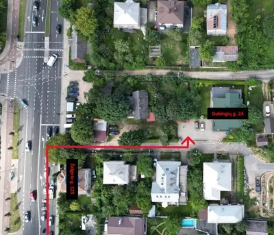 a red arrow pointing to a house in a suburb at Jaukūs apartamentai Free parking in Vilnius