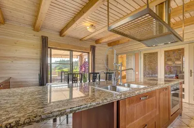 a kitchen with a sink and a counter at Country house Stirnamis in Mindūnai