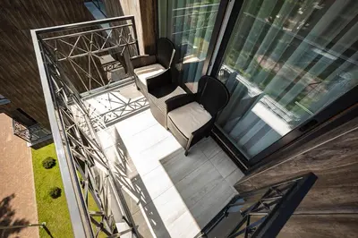 an overhead view of a balcony with two chairs and a window at FoRest Apartments in Druskininkai