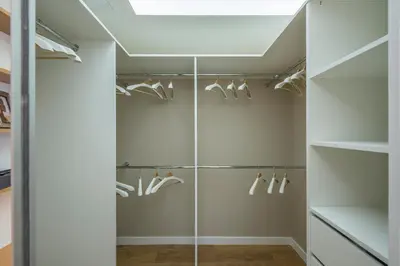 a walk in shower with glass doors at Hills Park Luxury Apartment in Vilnius