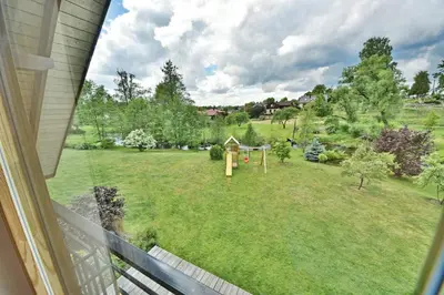 a view from a window of a yard with a playground at Atostogų namelis Druskininkuose in Druskininkai