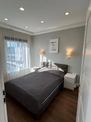 a bedroom with a large bed and a window at Your home - Spacious Apartment in City Center, with Balcony & Self Check-in in Vilnius
