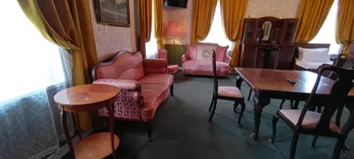 a living room with a couch and chairs and a table at Labanoro troba in Labanoras