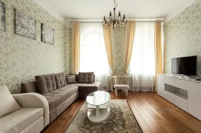 a living room with a couch and a table at Apartment Gabriele in Old Town Vilnius in Vilnius