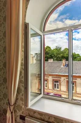 a window with a view of a building at Apartment Gabriele in Old Town Vilnius in Vilnius