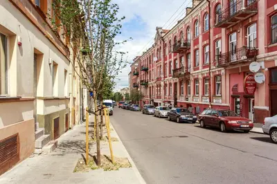 a street with cars parked on the side of the road at Apartment Gabriele in Old Town Vilnius in Vilnius