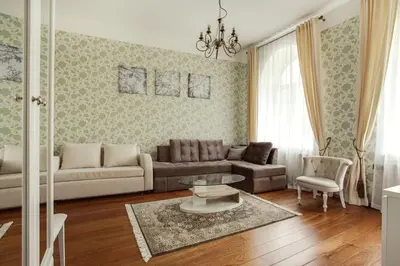 a living room with a couch and a table at Apartment Gabriele in Old Town Vilnius in Vilnius
