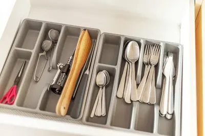 a drawer filled with utensils in a refrigerator at #stayhere - Modern Designer 1BDR Apartment in Artistic District in Vilnius