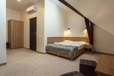 a bedroom with a bed in a room at Old Town Trio in Vilnius
