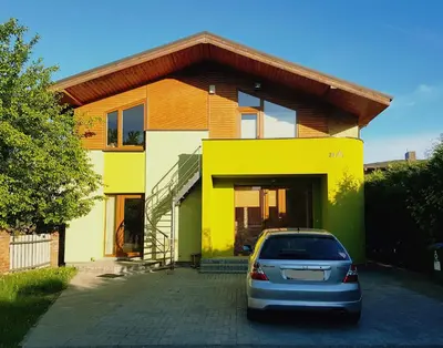 a car parked in front of a house at K-Town - Cozy Apartment Near the City Center in Kaunas
