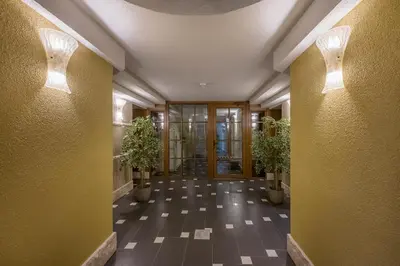a hallway with potted plants in a building at Kesminta Apartments in Vilnius