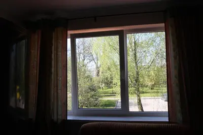 a window in a room with a view of a yard at Kernavės centras in Kernavė
