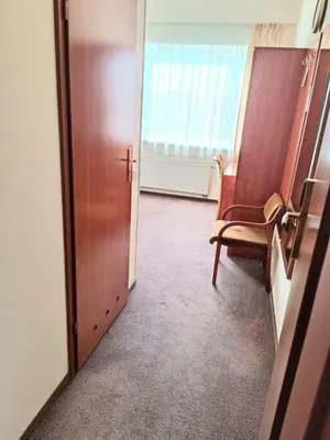an empty room with a chair and a door at Smėlynė in Panevėžys