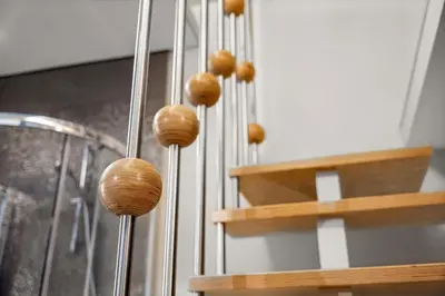 a bunch of woodenoons on the strings of a guitar at Secret Lounge - Cozy Studio with Sauna and Jacuzzi in Vilnius