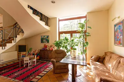 a living room with a couch and a table at Regina in Druskininkai