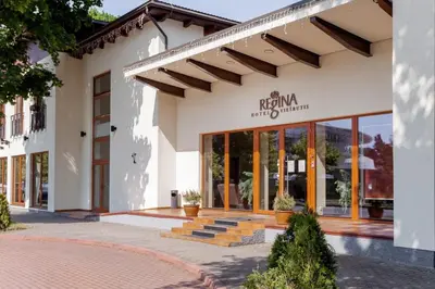 a facade of a building with a sign on it at Regina in Druskininkai