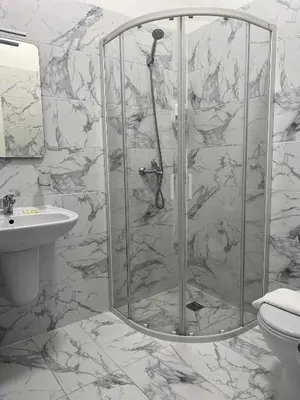 a bathroom with a shower and a sink at Via Baltica in Sargėnai